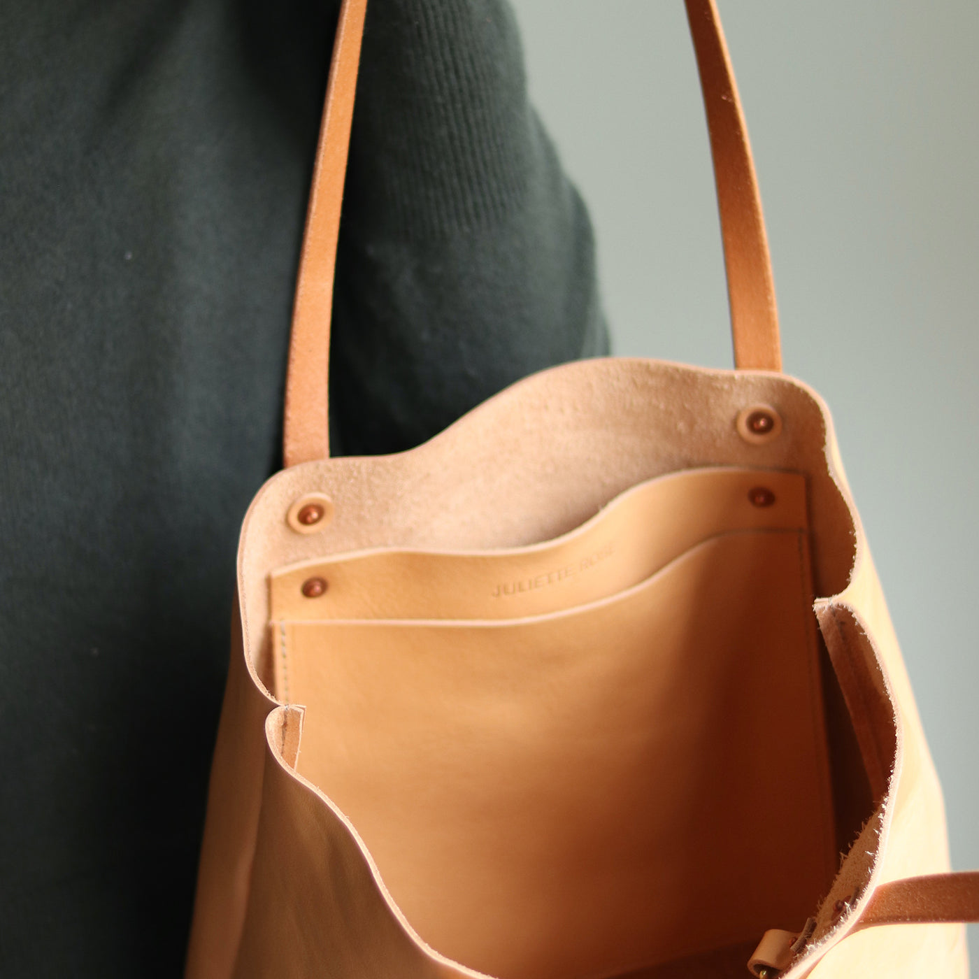 Minimalist beige leather tote with interior slip pocket and D-ring for keys, made in Vermont.