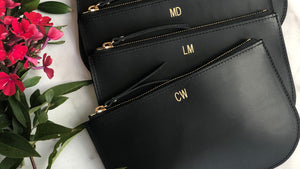 Personalized black leather clutches for bridesmaid party gift.  Handmade with premium vegetable tanned leather, with top zipper and gold foil monogram