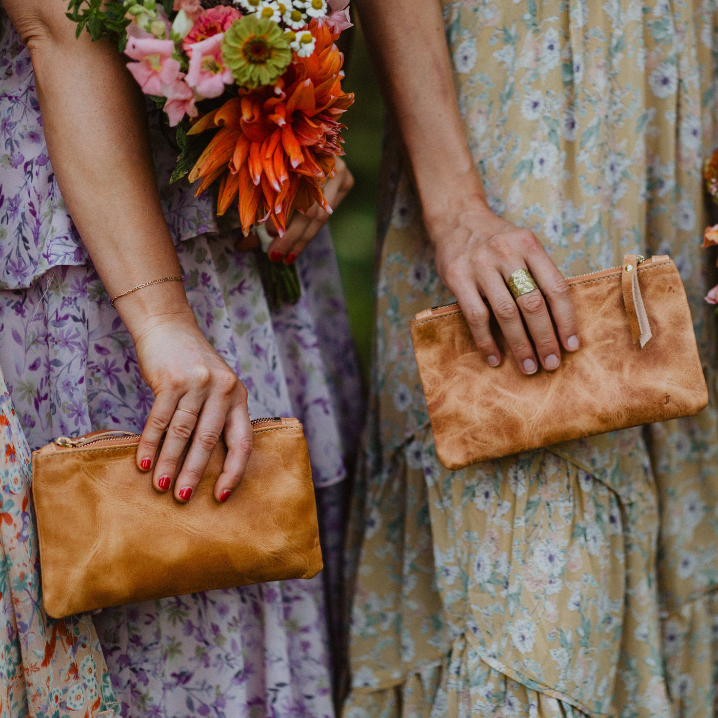 brown leather bridesmaid clutch.  The clutch is handmade with horween dublin and derby leather.  The leather zipper clutch can be monogrammed for a perfect bridesmaid gift. Handmade by Juliette Rose Designs. Photo by Corinne Ryan Photography.