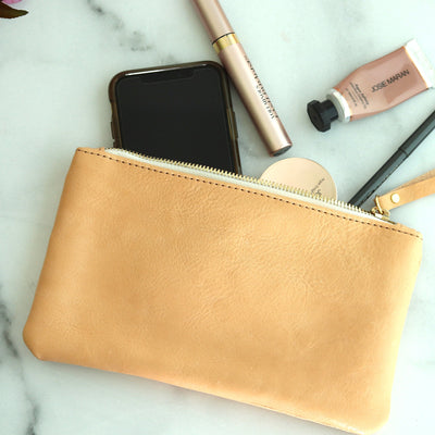 The perfect gift for your bridesmaids or bridal party! This small beige leather clutch will go with any dress color, and is handmade with natural vegetable tanned leather and a premium top zipper.  Monogram the clutch for a personalized gift! Handmade in Vermont by Juliette Rose Designs