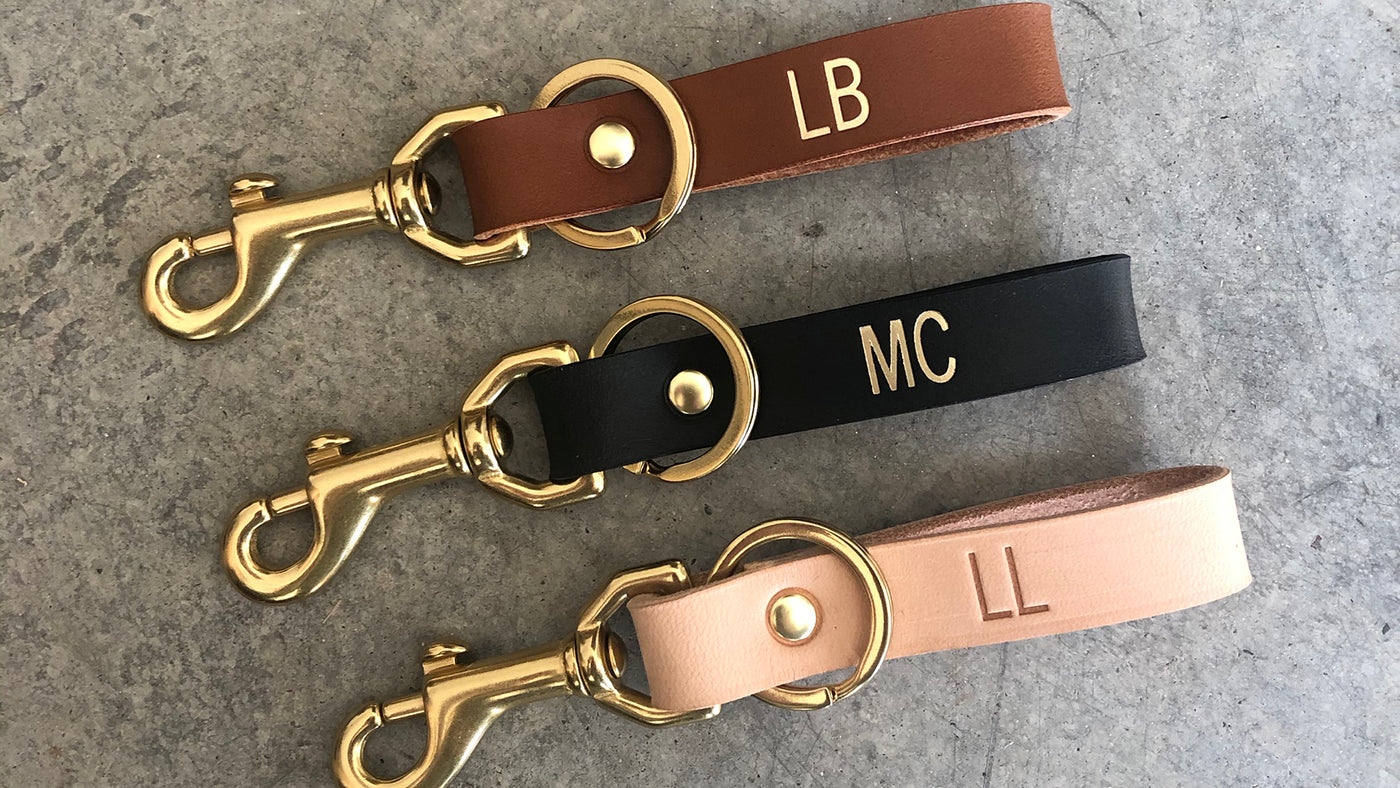 Personalized Leather Keychains with gold foil monogram. Handmade with vegetable tanned leather and solid brass keyring and clasp.