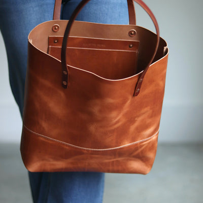 Horween leather tote with pull-up finish, interior slip pocket, and D-ring for keys.