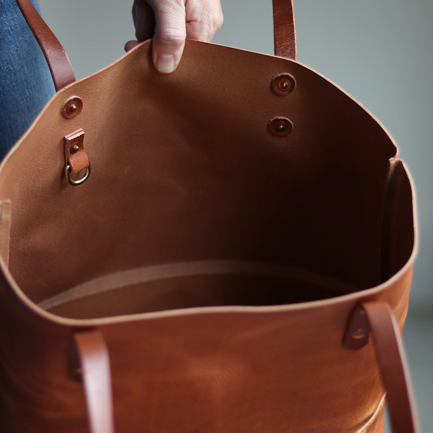 Horween leather tote with pull-up finish, interior slip pocket, and D-ring for keys.
