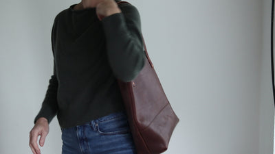 Handmade dark brown vegetable tanned leather minimalist tote with copper rivets