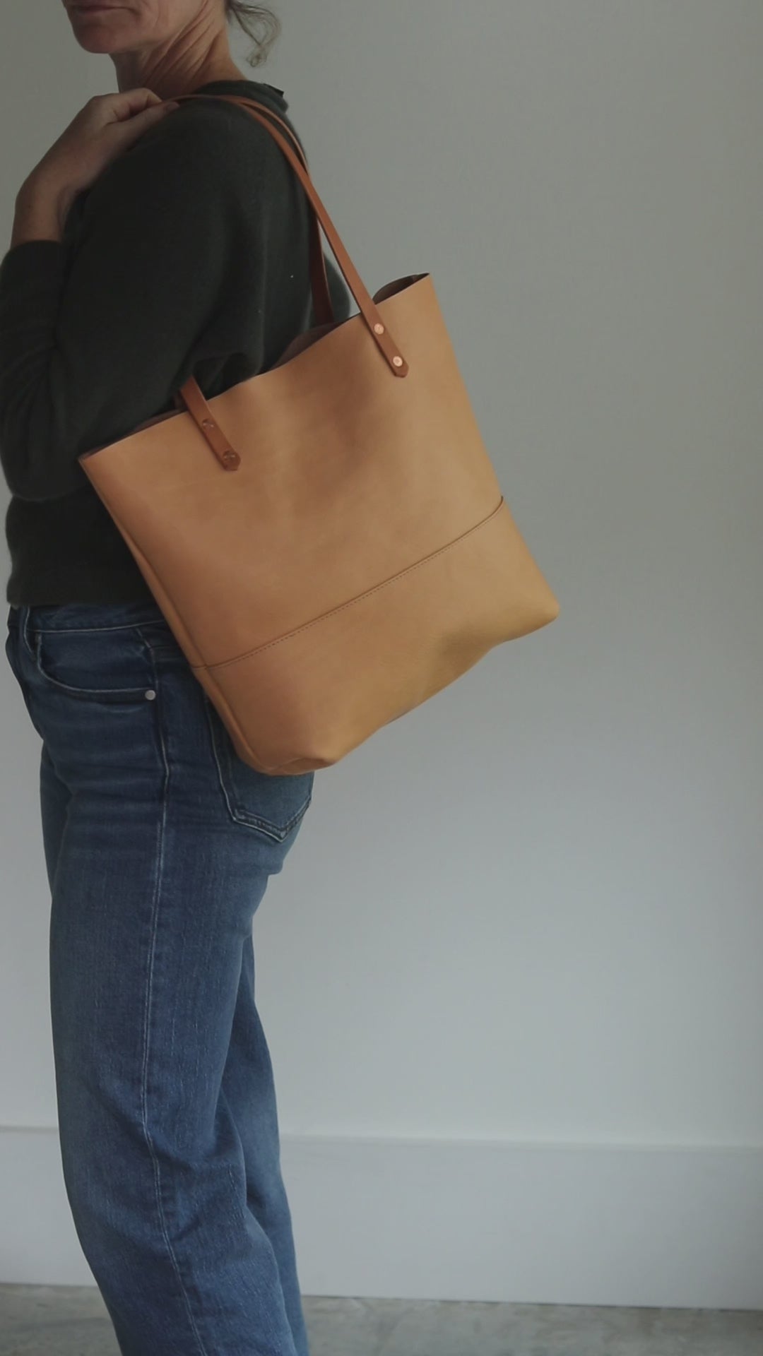 Minimalist beige leather tote with interior slip pocket and D-ring for keys, made in Vermont.