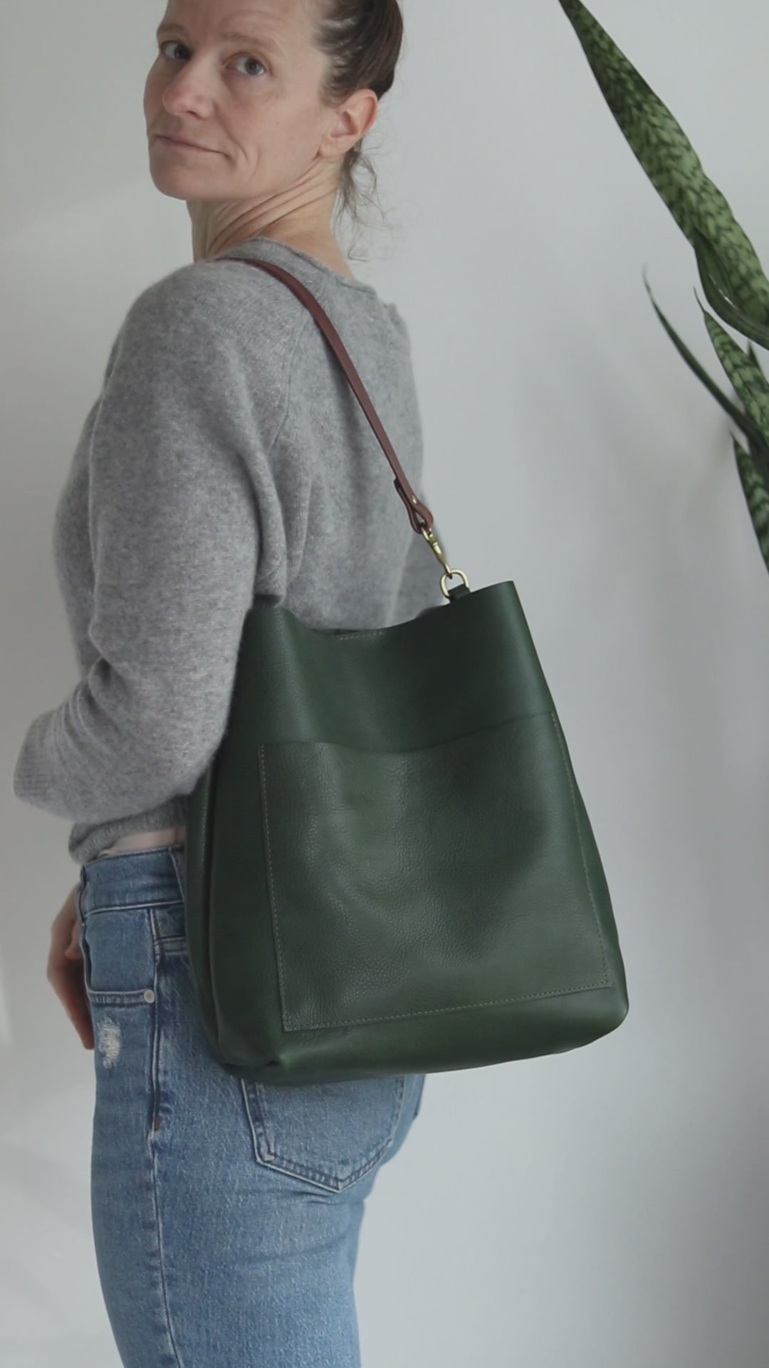 Green pebble leather shoulder bag with front pocket