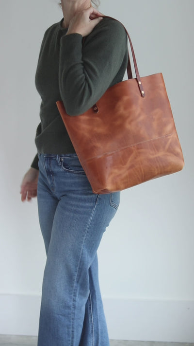 Distressed brown Horween leather tote bag with unique pull-up and copper rivet details, handcrafted in Vermont.