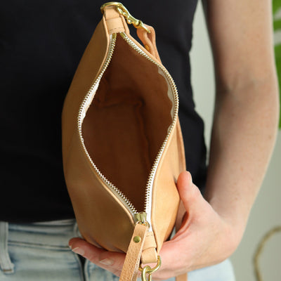 Inside of small soft beige leather purse with top zipper and removable strap.  Converts to an evening clutch purse, handmade with vegetable tanned leather by Juliette Rose Designs